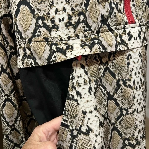 ALALA snakeskin anorak with red accents